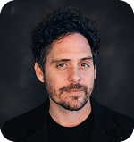 Corey Woessner, team member at Prosperia Marketing, with a professional appearance and dark background.