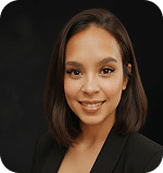Nika Martinez, Prosperia Marketing team member, professional headshot with dark background.